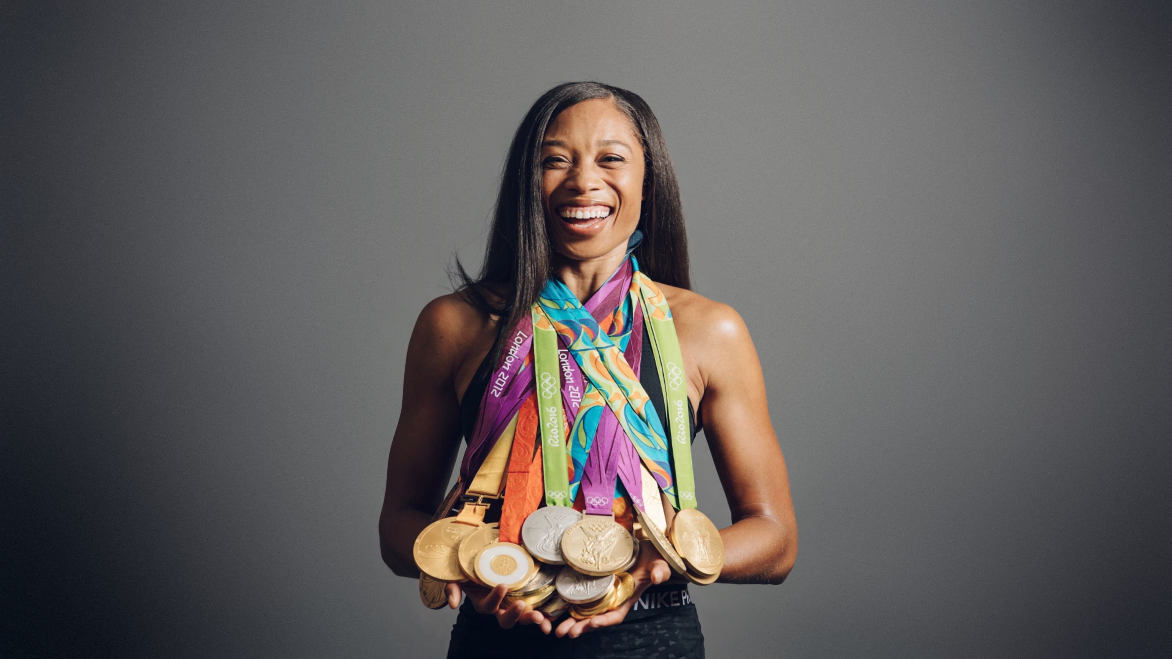Allyson Felix wearing her olympic medals